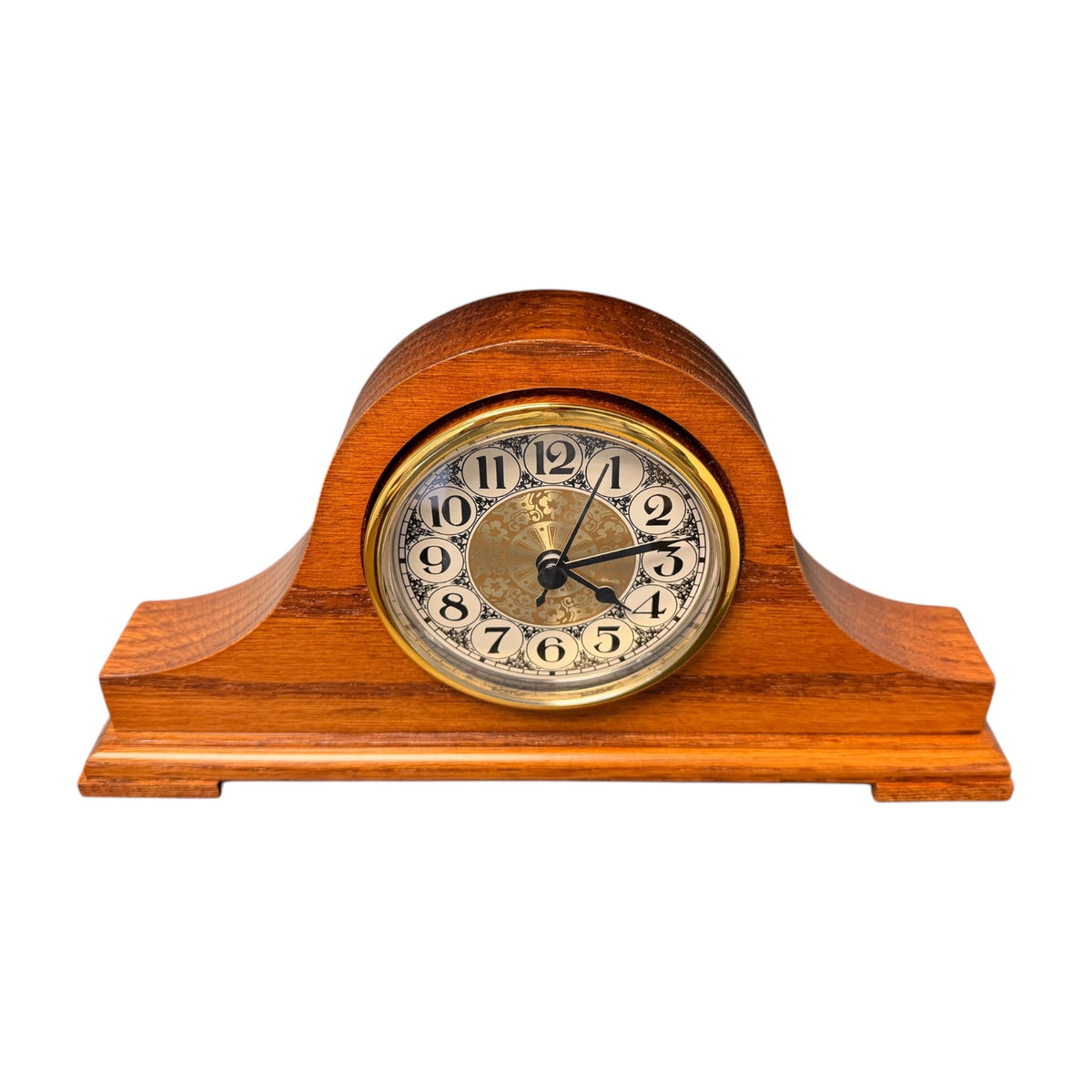 Oak tambour desk clock with gold bezel and ivory dial, angled front view