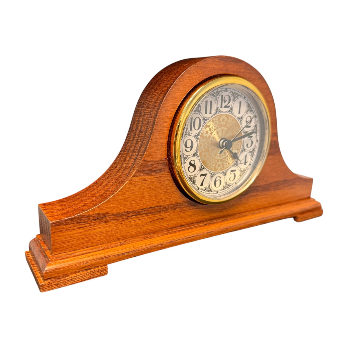 Close three-quarter view of the oak tambour desk clock face and gold bezel