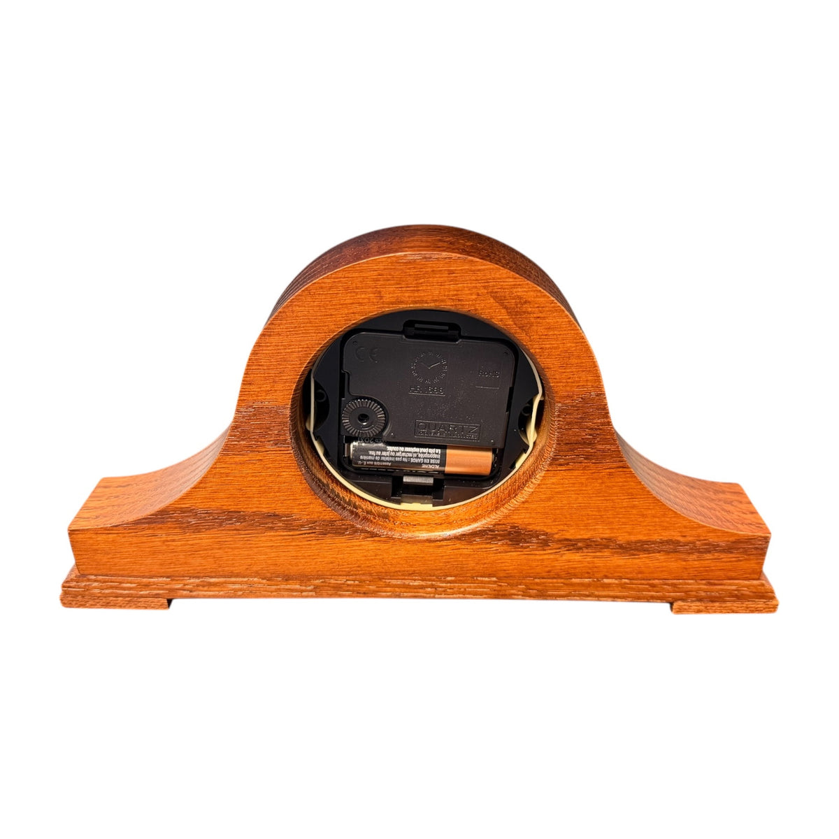 Back of the oak tambour desk clock showing the quartz movement and battery compartment